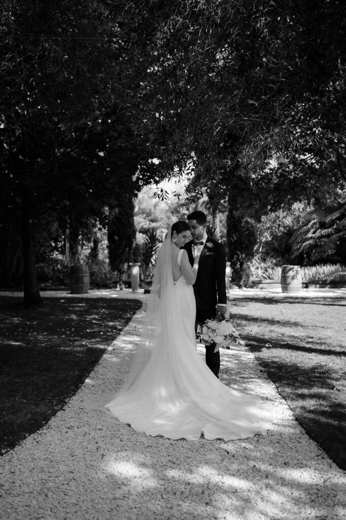 bride wearing trish peng wedding dress at markovina estate in auckland