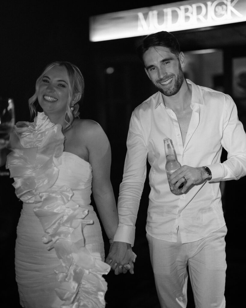 happy bride and groom at mudbrick vineyard wedding reception